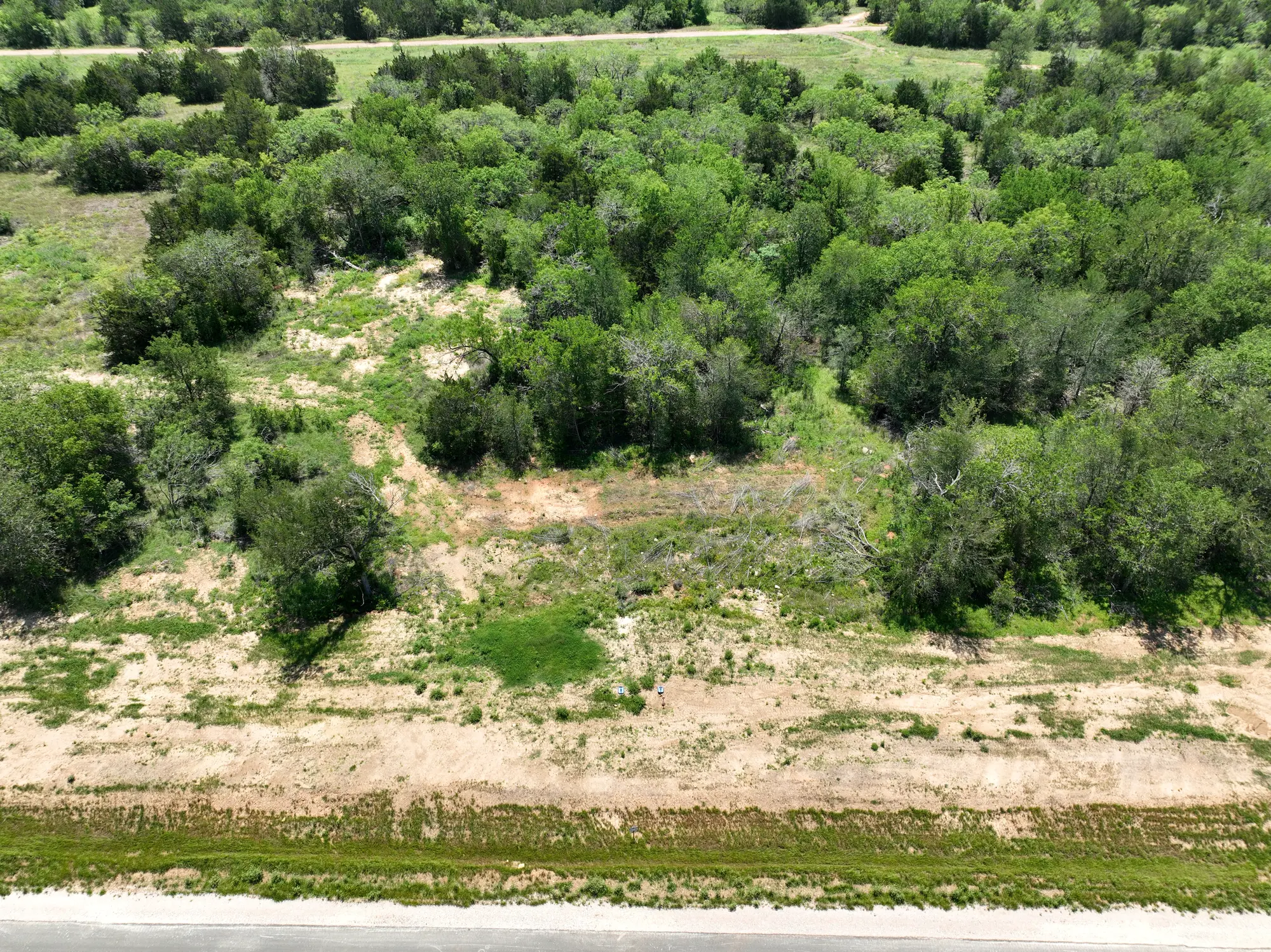 Camp Swift Estates aerial photo 3 &mdash; treed half-acre homesites in Bastrop, TX