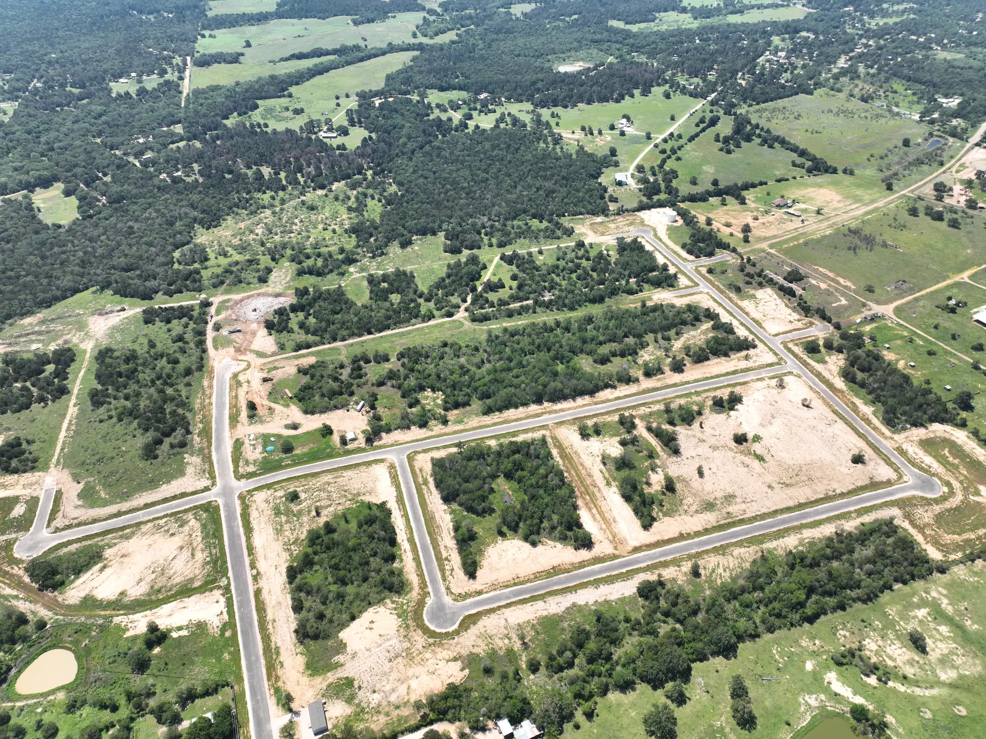 Camp Swift Estates aerial view &mdash; half-acre lots for sale in Bastrop, TX with paved streets